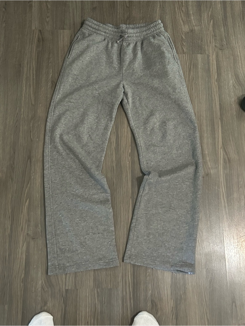 Relaxed fit straight leg grey sweatpants with open hem
